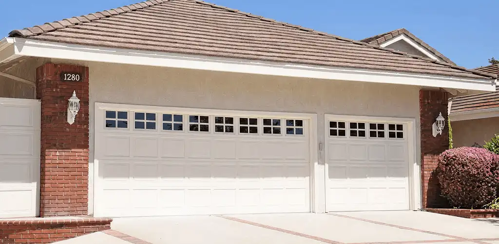 Residential garage door repair service for a double garage door in Cedar Rapids, IA