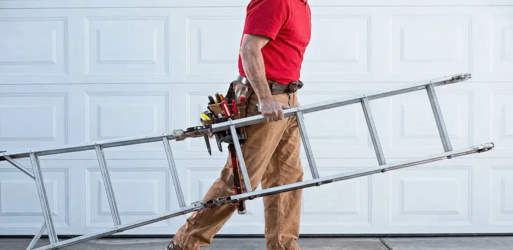 Garage door repair technician arriving with tools and ladder in Cedar Rapids, IA