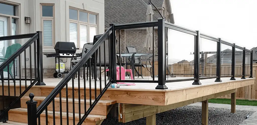 Handrail installation on a deck staircase for safety and code compliance in Cedar Rapids, IA